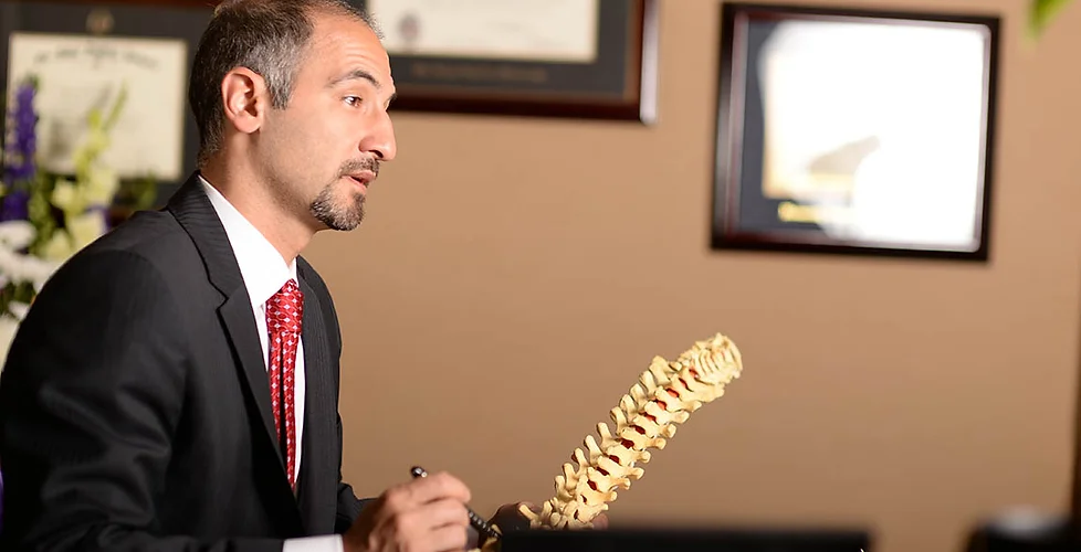 Dr. Farjoodi showing backbone model
